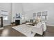 Bright living room with a fireplace, shiplap accent wall, hardwood flooring, and neutral-toned furnishings at 277 High Ridge Ln, Pittsboro, NC 27312