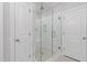 Tiled shower with glass enclosure, bench, and niche shelving at 277 High Ridge Ln, Pittsboro, NC 27312