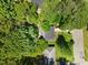 Aerial view of home surrounded by lush trees at 2904 Sprucewood Dr, Durham, NC 27707