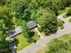 Aerial view of home with lush landscaping, front yard, and driveway at 2904 Sprucewood Dr, Durham, NC 27707