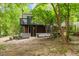 Backyard with deck and stairs, showcasing the home's outdoor space and lush landscaping at 2904 Sprucewood Dr, Durham, NC 27707