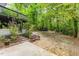Spacious backyard with a deck, patio, and wooden features, perfect for outdoor living at 2904 Sprucewood Dr, Durham, NC 27707