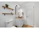 Stylish bathroom featuring modern vanity, sleek fixtures, and organized storage solutions at 2904 Sprucewood Dr, Durham, NC 27707