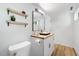Chic bathroom with wood countertop vanity, updated hardware, and modern fixtures at 2904 Sprucewood Dr, Durham, NC 27707