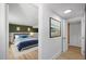 Comfortable bedroom view highlighting natural light, stylish decor, and seamless flow into the hallway at 2904 Sprucewood Dr, Durham, NC 27707