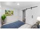 Bright bedroom with a sliding barn door closet and neutral decor at 2904 Sprucewood Dr, Durham, NC 27707