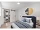 Comfortable bedroom with a sliding barn door closet and stylish accents at 2904 Sprucewood Dr, Durham, NC 27707