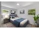 Cozy bedroom with a comfortable bed, soft lighting, and artistic decor for a peaceful retreat at 2904 Sprucewood Dr, Durham, NC 27707