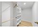 Bright closet with custom shelving and hanging rods for optimal storage and organization at 2904 Sprucewood Dr, Durham, NC 27707
