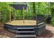 Backyard elevated deck with pergola that provides an inviting spot surrounded by natural beauty at 2904 Sprucewood Dr, Durham, NC 27707