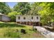 Two-story home with green lawn, red brick base, and an asphalt driveway at 2904 Sprucewood Dr, Durham, NC 27707