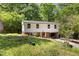 Two-story home with green lawn, red brick base, and an asphalt driveway at 2904 Sprucewood Dr, Durham, NC 27707