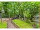 The backyard displays raised garden beds, ideal for gardening enthusiasts and outdoor enjoyment at 2904 Sprucewood Dr, Durham, NC 27707