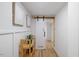 Inviting hallway with modern barn door, wood floors, stylish decor, and neutral color palette at 2904 Sprucewood Dr, Durham, NC 27707