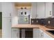 Well-lit kitchen with wooden countertops, modern appliances, and sleek white cabinetry at 2904 Sprucewood Dr, Durham, NC 27707