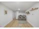 Well-equipped laundry area with front-load washer and dryer, storage shelves, and updated finishes at 2904 Sprucewood Dr, Durham, NC 27707