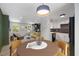 Bright living space featuring modern decor, a kitchen with white cabinets, and large windows at 2904 Sprucewood Dr, Durham, NC 27707