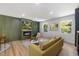 Comfortable living room boasts fireplace, stylish furniture, and natural light for relaxation at 2904 Sprucewood Dr, Durham, NC 27707