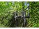 Treehouse with stairs embraced by foliage, creating an adventurous outdoor retreat within nature's embrace at 2904 Sprucewood Dr, Durham, NC 27707