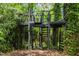 A multi-tiered treehouse featuring spiral stairs, offering a unique and adventurous outdoor escape at 2904 Sprucewood Dr, Durham, NC 27707