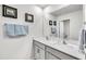 Bright bathroom with double sinks, framed art, and well-lit vanity at 2923 Cullens Dr, Graham, NC 27253