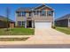 Charming two-story home featuring a well-manicured lawn, a two-car garage, and classic curb appeal at 2923 Cullens Dr, Graham, NC 27253