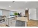 Open kitchen features stainless steel appliances, a center island and leads into the living room at 2923 Cullens Dr, Graham, NC 27253