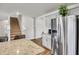 Modern kitchen with granite countertops, stainless steel appliances, and easy access to the staircase at 2923 Cullens Dr, Graham, NC 27253