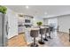 Modern kitchen with a large island, granite countertops, seating, and stainless steel appliances at 2923 Cullens Dr, Graham, NC 27253