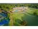 Aerial view of clubhouse with pool, tennis courts, and golf course at 3203 Rugby Rd, Durham, NC 27707