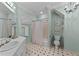 Mint green bathroom featuring wainscoting and patterned floors at 3203 Rugby Rd, Durham, NC 27707