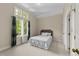 Cozy bedroom with a large window with curtains and a comfortable bed at 3203 Rugby Rd, Durham, NC 27707