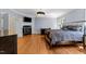 Main bedroom boasts wood floors, fireplace, and view of the yard at 3203 Rugby Rd, Durham, NC 27707