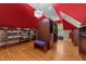 Large walk-in closet with custom shelving, storage, and a statement chandelier at 3203 Rugby Rd, Durham, NC 27707