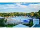 Community pool with many lounge chairs and umbrellas at 3203 Rugby Rd, Durham, NC 27707