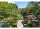 Long driveway lined with trees leading up to the property at 3203 Rugby Rd, Durham, NC 27707