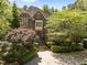 A charming two-story brick home with a neatly landscaped yard and symmetrical design at 3203 Rugby Rd, Durham, NC 27707