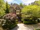 A charming two-story brick home with a neatly landscaped yard and symmetrical design at 3203 Rugby Rd, Durham, NC 27707