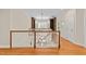 Traditional foyer with hardwood floors, white banister and decorative lighting at 3203 Rugby Rd, Durham, NC 27707