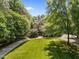 A charming two-story brick home with a neatly landscaped yard and circular driveway at 3203 Rugby Rd, Durham, NC 27707