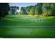 Golf course with three golfers visible at 3203 Rugby Rd, Durham, NC 27707