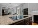 Modern kitchen island features sleek countertops and state-of-the-art cooktop with a view at 3203 Rugby Rd, Durham, NC 27707