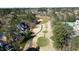 Overhead shot of a golf course and neighborhood with mature trees at 325 Hogans Valley Way, Cary, NC 27513