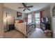 Comfortable bedroom featuring a metal bed frame, neutral walls, and bright natural light at 325 Hogans Valley Way, Cary, NC 27513