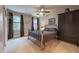 Spacious bedroom with natural light, ceiling fan, neutral walls, and closet space at 325 Hogans Valley Way, Cary, NC 27513