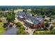 Aerial shot showcasing the grand clubhouse nestled within lush greenery at 325 Hogans Valley Way, Cary, NC 27513