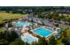 An aerial view of the community pools and recreational areas amid lush greenery at 325 Hogans Valley Way, Cary, NC 27513