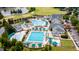 Aerial view of the community pool complex, complete with pools, lounge areas, and lush landscaping at 325 Hogans Valley Way, Cary, NC 27513