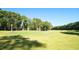 Beautiful view of the lush green golf course and mature tree lined properties at 325 Hogans Valley Way, Cary, NC 27513