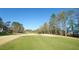 Picturesque view of the lush golf course with a home at the left at 325 Hogans Valley Way, Cary, NC 27513